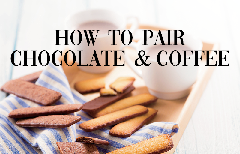 Wooden tray with striped cloth, two white mugs, butter cookies, some chocolate-dipped. Text overlay: “HOW TO PAIR CHOCOLATE & COFFEE.”