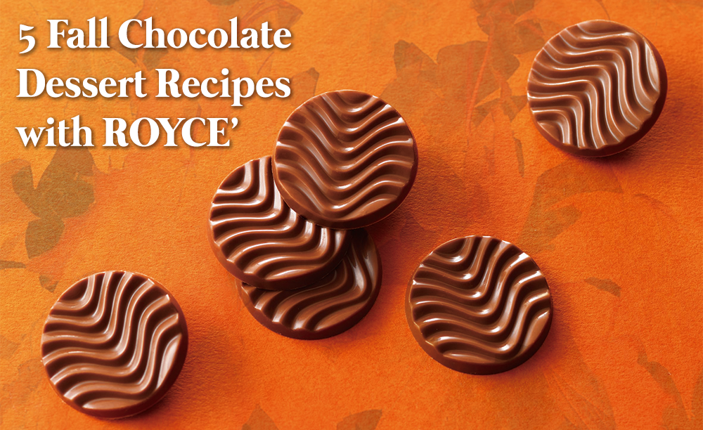 Five milk chocolate buttons with wavy patterns are displayed on an autumn-themed background with text: “5 Fall Chocolate Dessert Recipes with ROYCE’”.