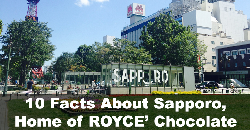 Outdoor plaza in Sapporo with SAPPORO installation, flower beds, benches, and Sapporo TV Tower; text reads “10 Facts About Sapporo, Home of ROYCE’ Chocolate.”