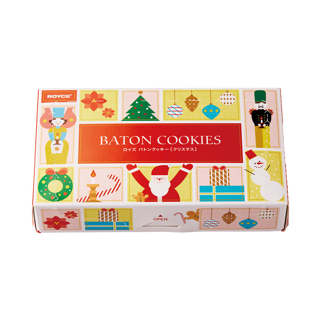 ROYCE' Chocolate - Baton Cookies "Christmas" - Image shows a printed box with various holiday illustrations. Text says ROYCE' Baton Cookies Open. Background is in white.