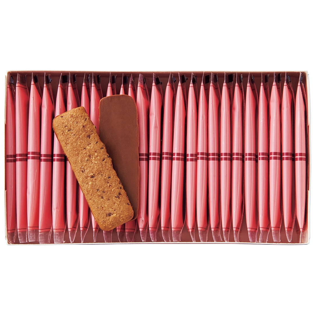 Baton Cookies Hazel Cacao image shows an open box with individually-wrapped cookies with red packaging and cookies coated with milk chocolate.
