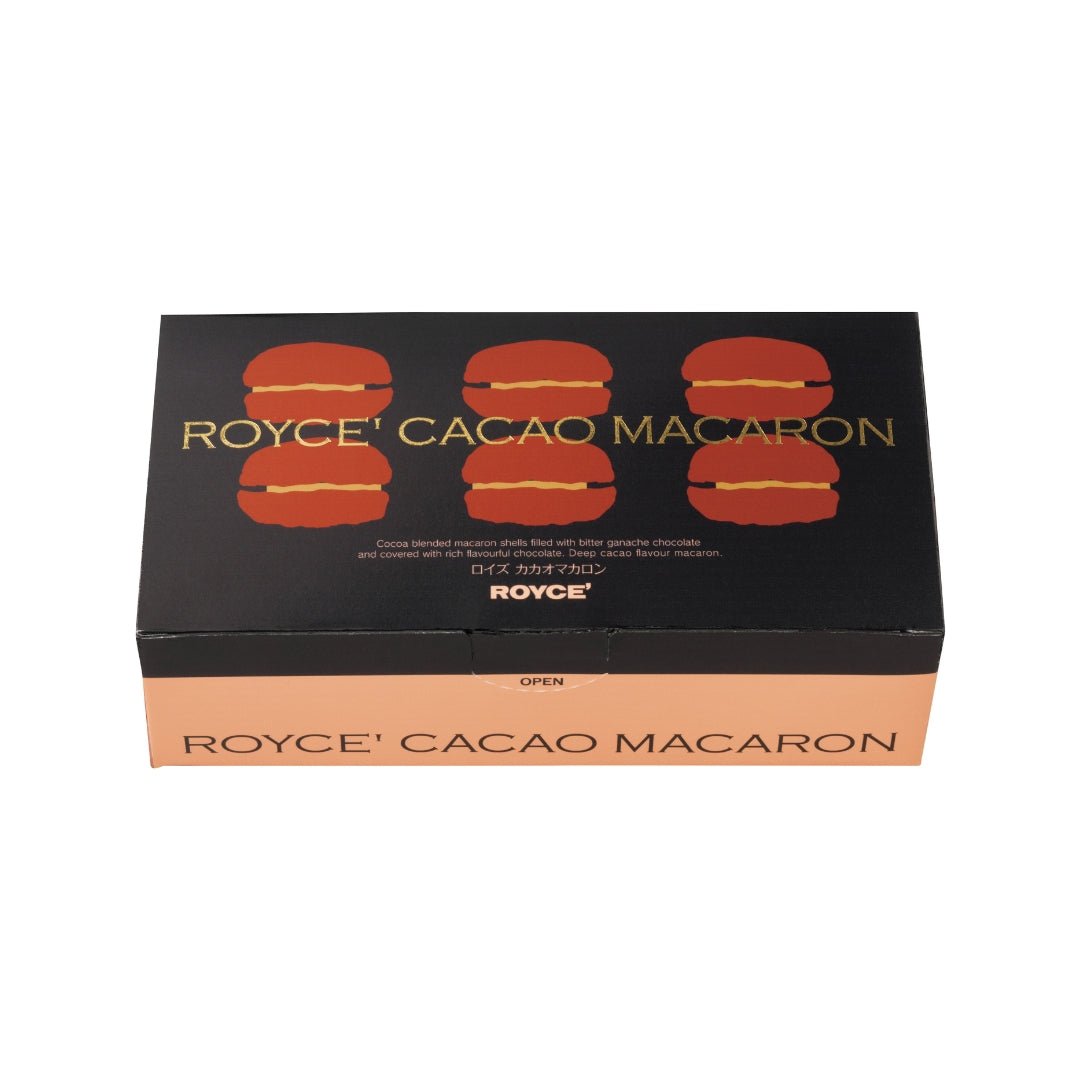 Cacao Macaron (6 Pcs) - Image shows a printed box in black and brown with illustrations of macarons. Text says ROYCE' Cacao Macaron ROYCE'.