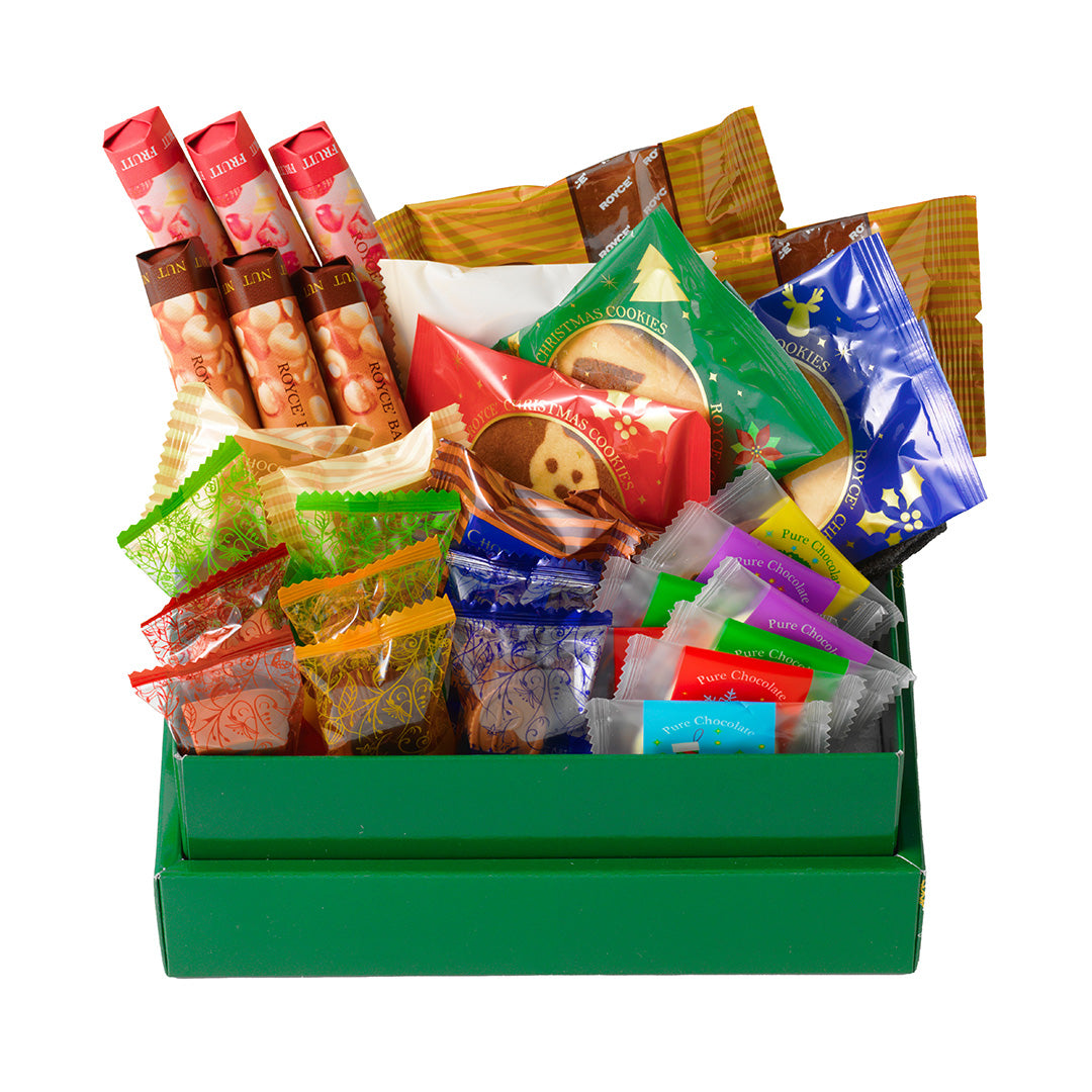 Image shows a green box with individually-wrapped chocolates. Background is in white.