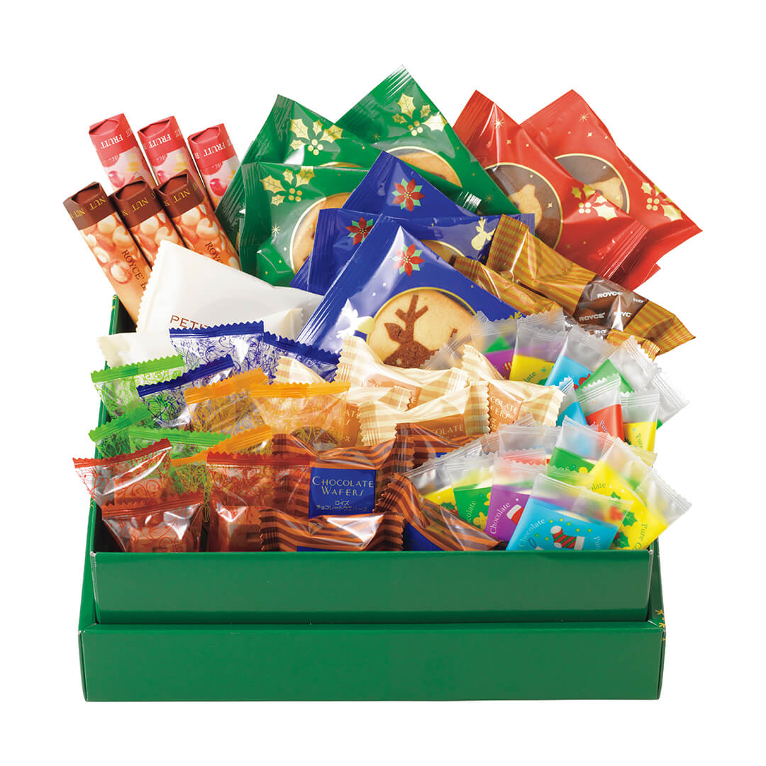 ROYCE' Chocolate - Christmas Selection (54 Pcs) - Image shows a green box filled with individually-wrapped chocolates in different shapes and sizes. Background is in white.