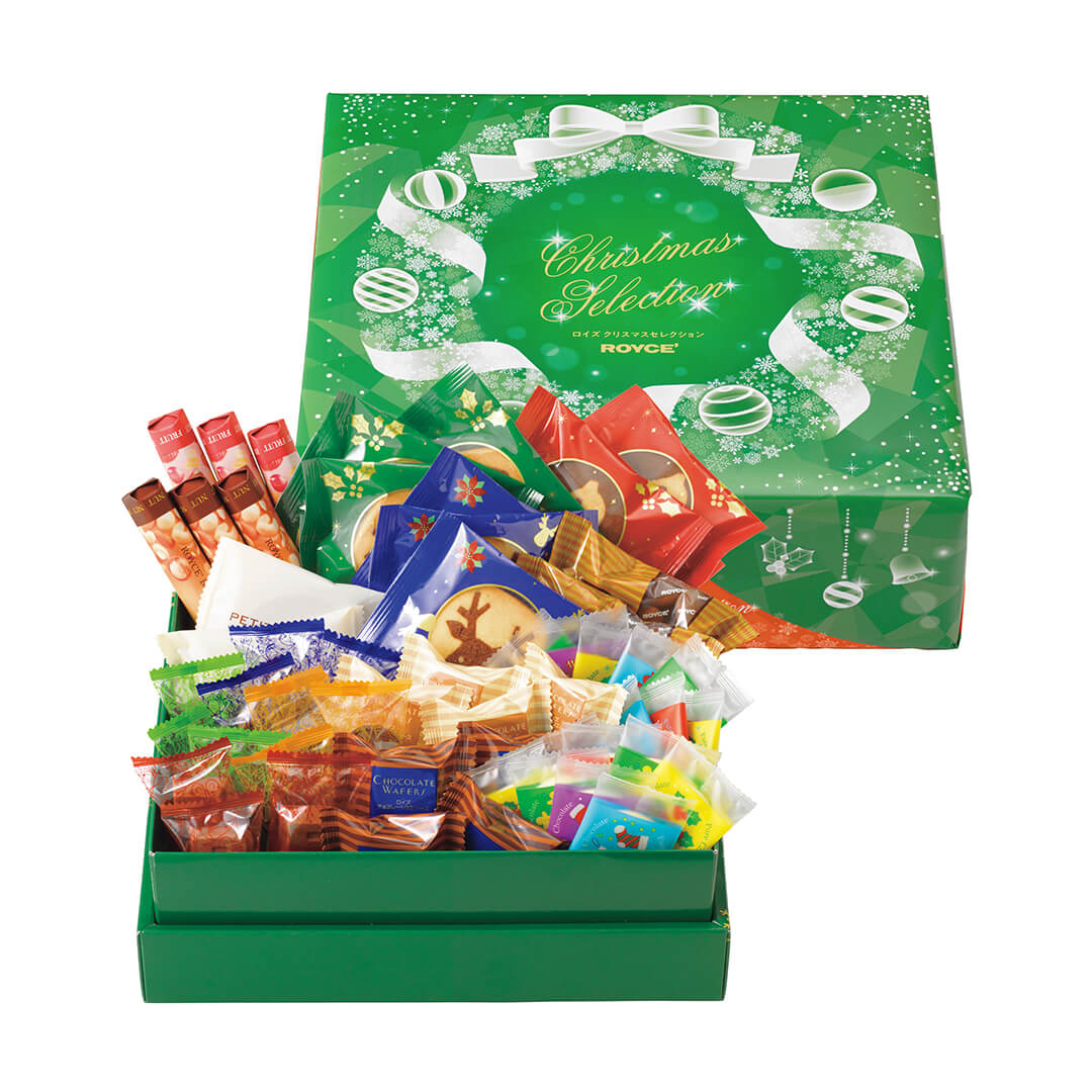 ROYCE' Chocolate - Christmas Selection (54 Pcs) - Image on lower left shows a green box filled with individually-wrapped chocolates in different shapes and sizes. Image on upper right shows a green printed box with text saying Christmas Selection ROYCE'. Background is in white.