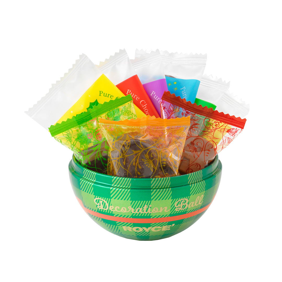 Image shows a green container with wrapped chocolates. Background is in white.