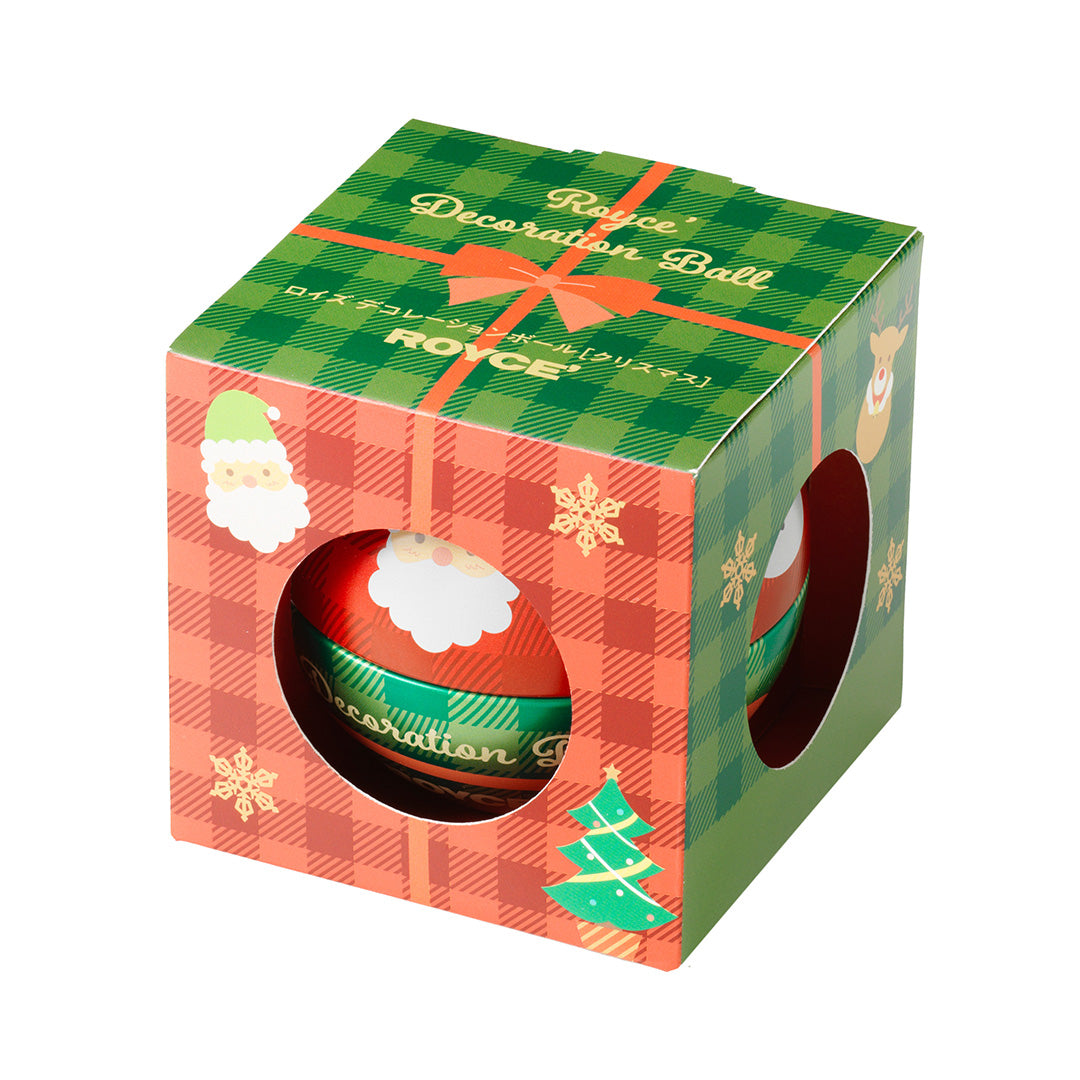 Image shows a printed box in red and green with illustrations of snowflakes, Santa Claus, a Christmas Tree, a ribbon, and reindeer. Text says ROYCE' Decoration Ball. ROYCE'.