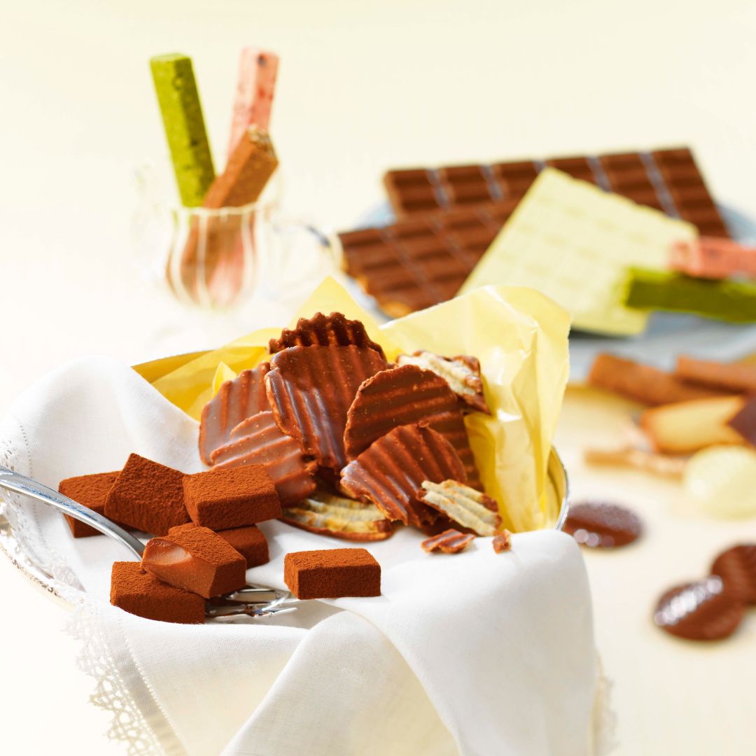 Image shows a setting of plated chocolates.