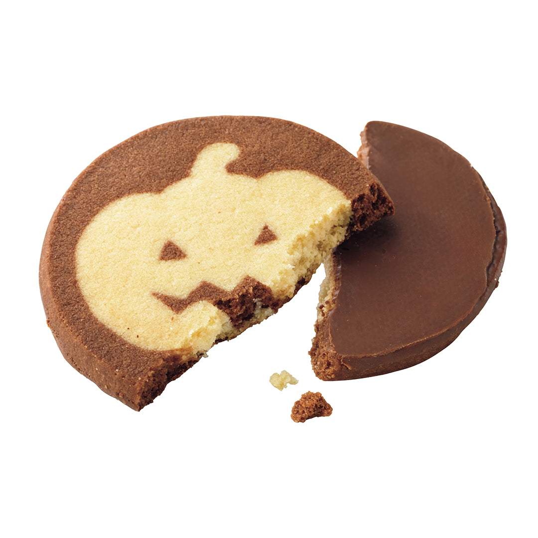ROYCE' Halloween Cookies (5 Pcs) - A split pumpkin-shaped cookie with a dark brown border and a pale cream center featuring a partial jack-o'-lantern face, shown on a plain white background.