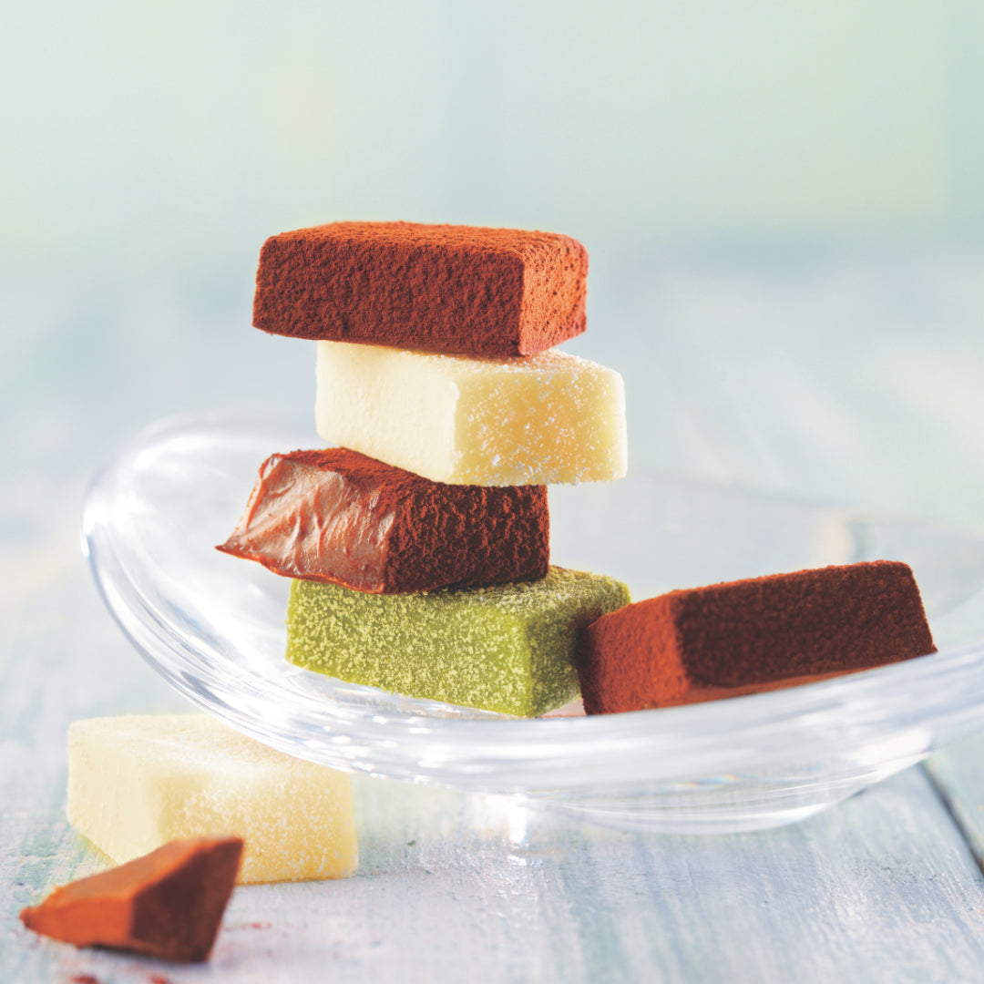ROYCE' Chocolate - Premium Nama Chocolate Collection - Image shows a stack of chocolate blocks on a clear plate.