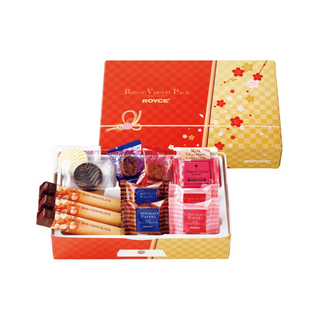 ROYCE' Variety Pack New Year - Image shows on top middle right a printed box in red and yellow with illustrations of flowers. Lower middle left box shows an open box with individually-wrapped confections in it. Text says ROYCE' Variety Pack ROYCE'.