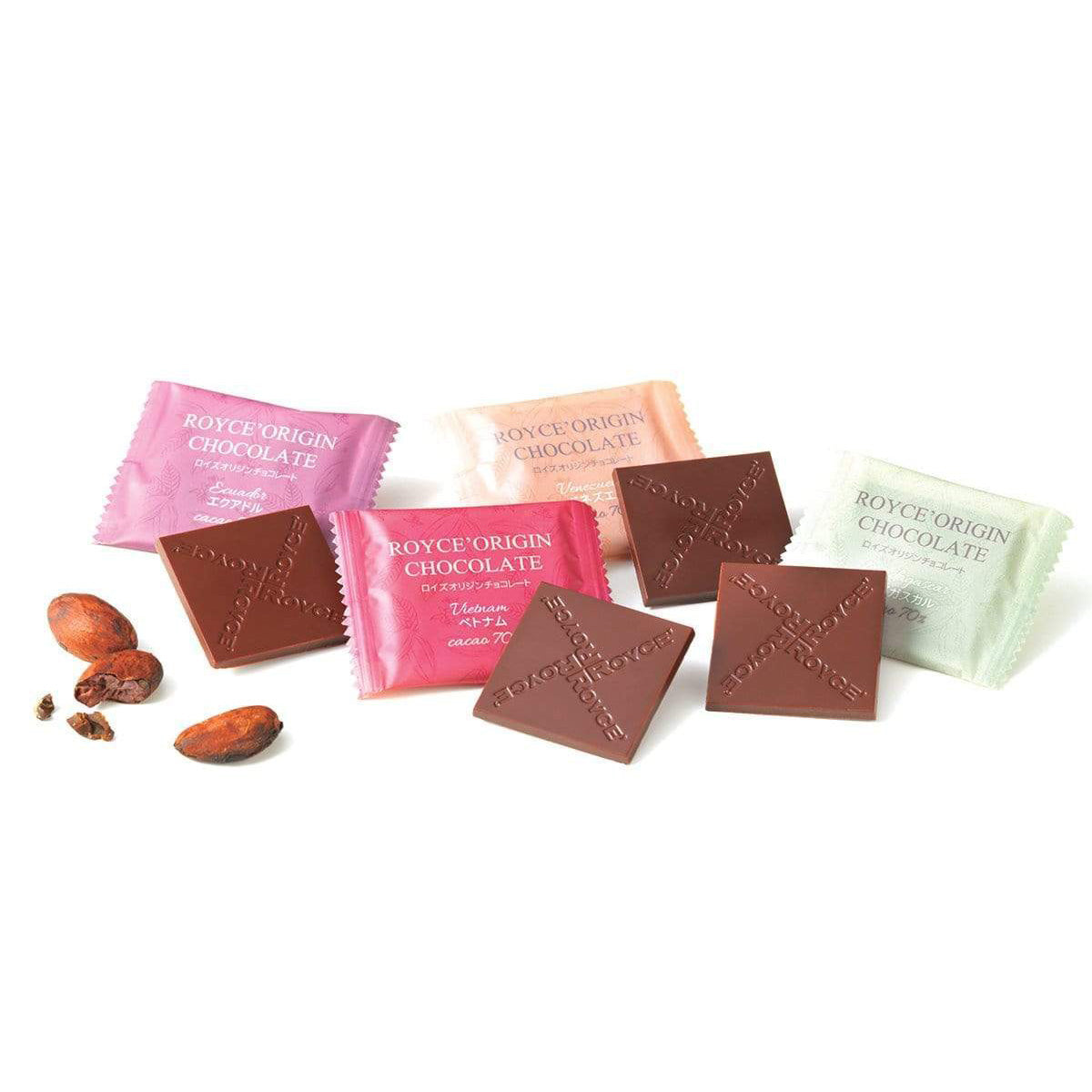 ROYCE' Chocolate - ROYCE' Origin Chocolate "Cacao 70%" - Image shows brown chocolate squares with the words "ROYCE'" engraved. From left: Pink wrapper with text of ROYCE' Origin Chocolate Ecuador Cacao 70 %, Pink wrapper with text of ROYCE' Origin Chocolate Vietnam Cacao 70%, Orange wrapper with text of ROYCE' Origin Chocolate Venezuela Cacao 70%, and Green wrapper with text of ROYCE' Origin Chocolate Madagascar Cacao 70 %. Accents include loose cacao beans.