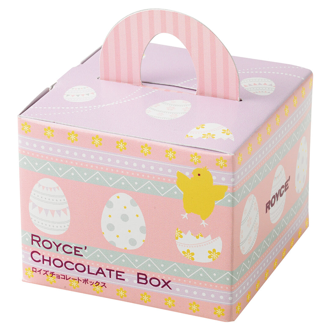 ROYCE' Chocolate - ROYCE' Chocolate Box "Sweet Eggs" - Image shows a printed box with illustrations of eggs, flowers, and a chick. Text says ROYCE' Chocolate Box ROYCE'. Background is in white.