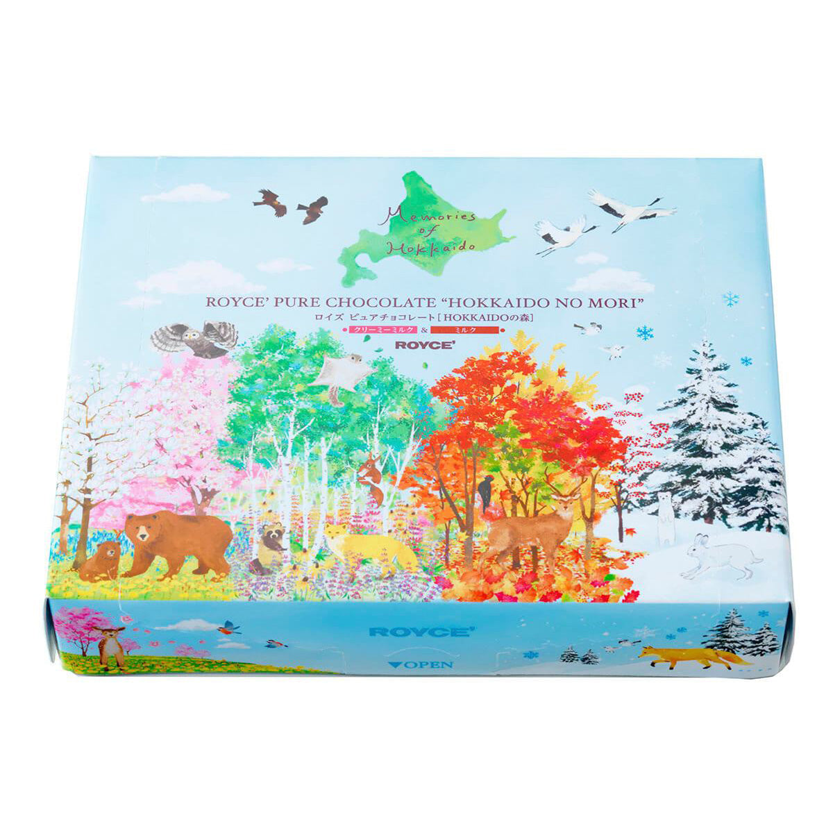 ROYCE' Chocolate - Pure Chocolate "Hokkaido No Mori" - Image shows a tilted blue box with illustrations of animals and plants. Text inside the box says Memories of Hokkaido ROYCE' Pure Chocolate "Hokkaido No Mori" ROYCE'.