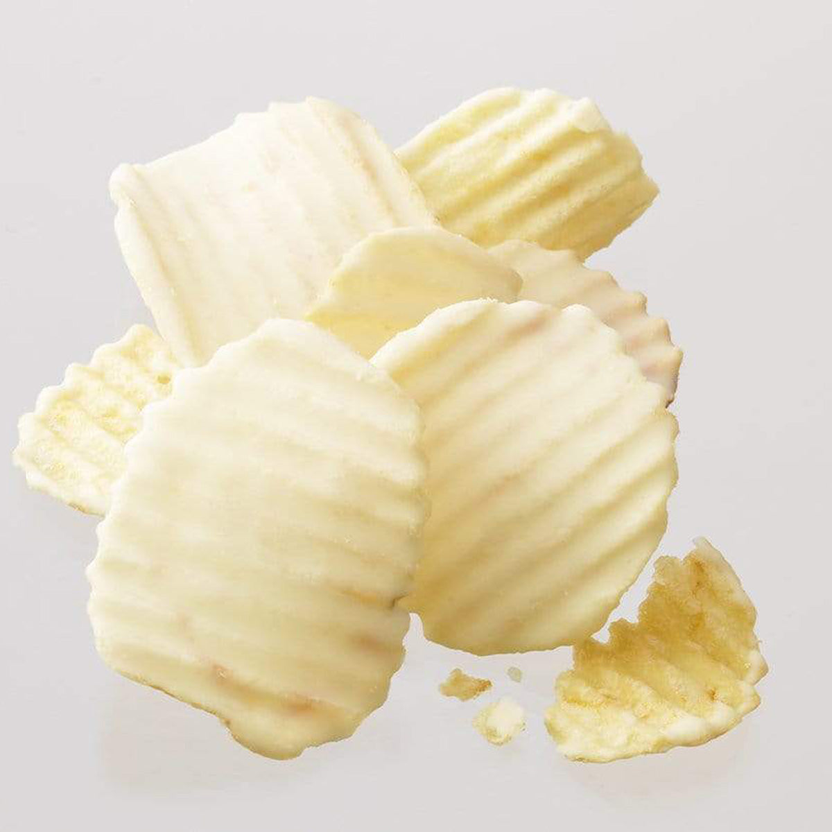 ROYCE' Chocolate - Potatochip Chocolate "Fromage Blanc" - Image shows white chocolate-coated potato chips with a ridged texture. Background is gray. 