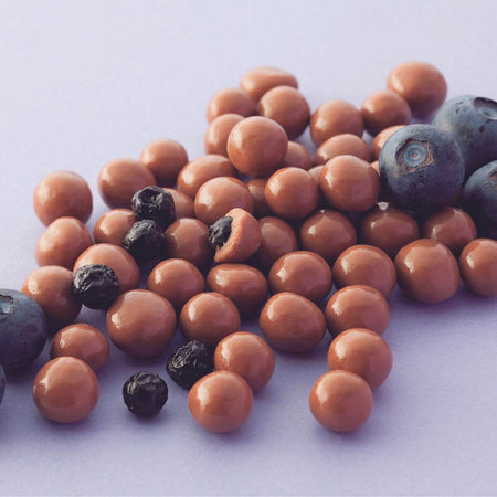 ROYCE' Chocolate - Blueberry Chocolate - Image shows blueberries and chocolate-coated berries with light purple background.