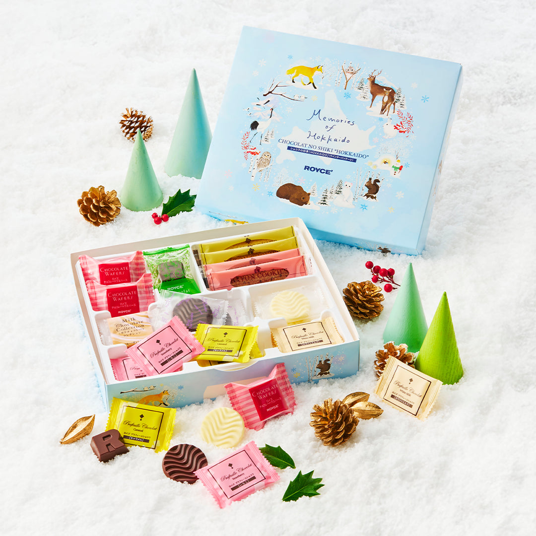 Chocolat No Shiki Hokkaido (Winter Package) showcases assorted chocolates and cookies in a snow-themed box with winter wildlife, perfect for gifting.