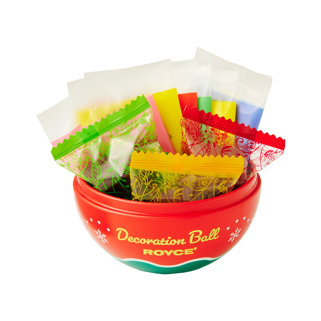 A decorative orb labeled 'Decoration Ball ROYCE' filled with assorted colorful candy packets, photographed on a clean white background.