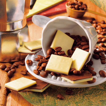 ROYCE' Chocolate - Espresso Chocolate - Image shows two-colored chocolate squares in white and brown in cups and plates with loose coffee beans.