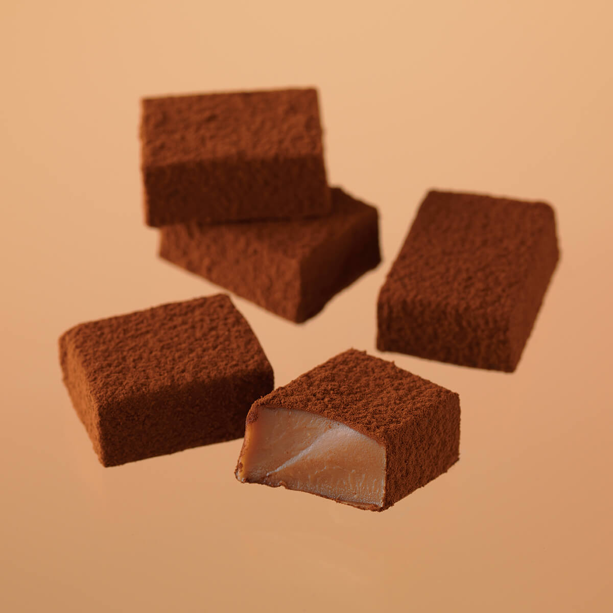 ROYCE' Chocolate - Image shows brown chocolate blocks with a brown background.