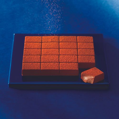 Image shows blue plate with chocolate blocks.