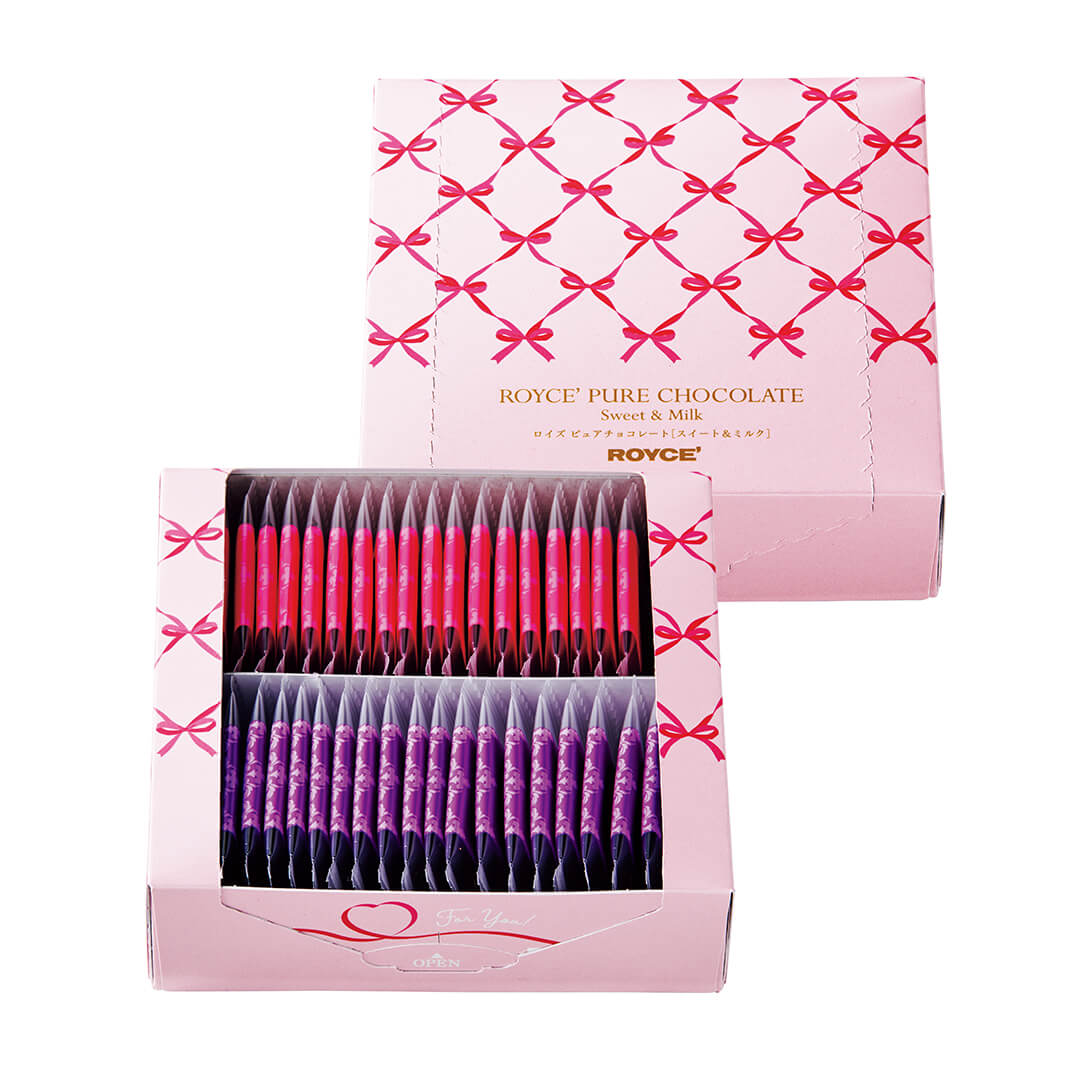 ROYCE' Chocolate - Pure Chocolate "Sweet & Milk" (Gift) - Image shows (upper right middle) a pink box with ribbon prints and gold text saying ROYCE' Pure Chocolate Sweet & Milk ROYCE' and (lower left middle) a pink box with pink ribbon-like prints filled with individually-wrapped chocolates in pink and violet. Visible text in white says For You! Open