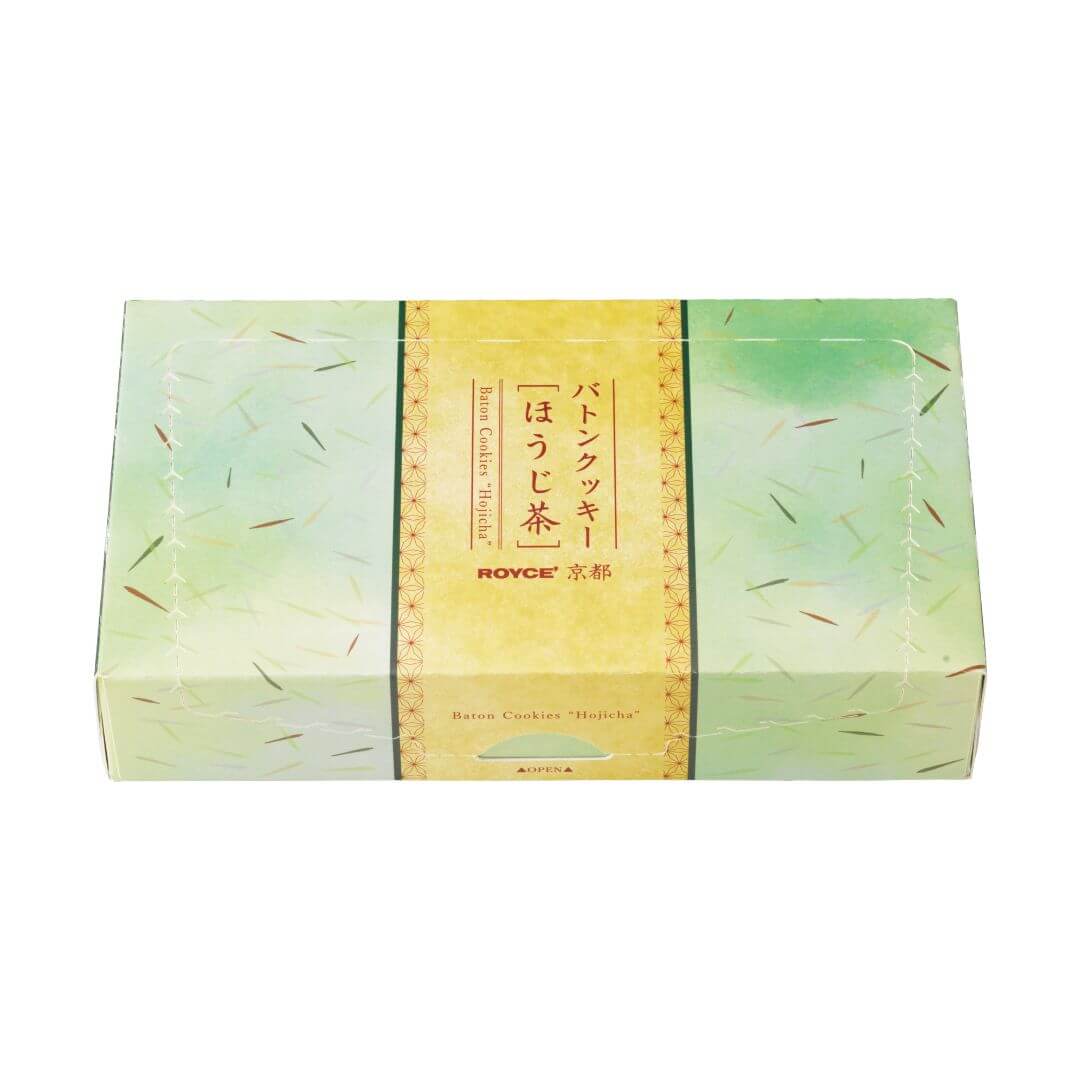 ROYCE' Chocolate - ROYCE' Kyoto Baton Cookies "Hojicha" - Image shows a printed box in green and yellow. Text in the middle says Baton Cookies "Hojicha", ROYCE', Baton Cookies "Hojicha", Open.