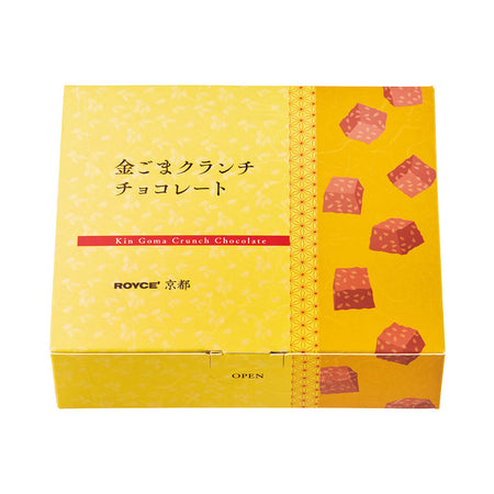 ROYCE' Kyoto Kin Goma Rocher - Image shows a printed box in different hues of yellow and red with illustrations of chocolates and other shapes. Text says Kin Goma Crunch Chocolate. ROYCE'. Open.