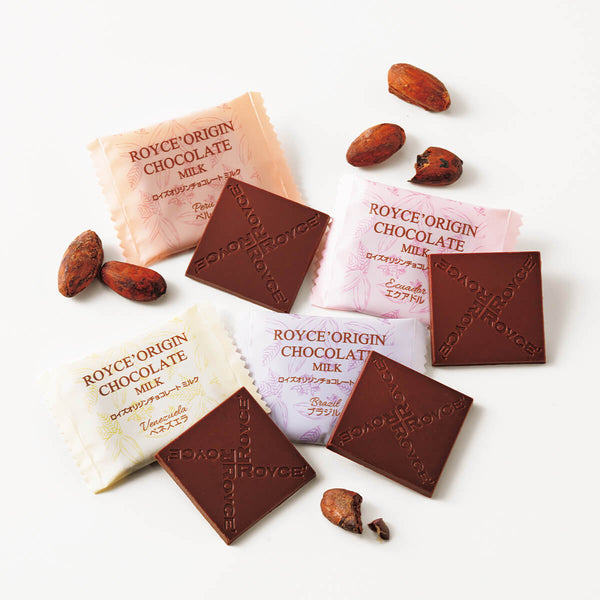 ROYCE' Chocolate - ROYCE' Origin Chocolate "Milk" - Image shows ROYCE' chocolate squares and packaging on a white background