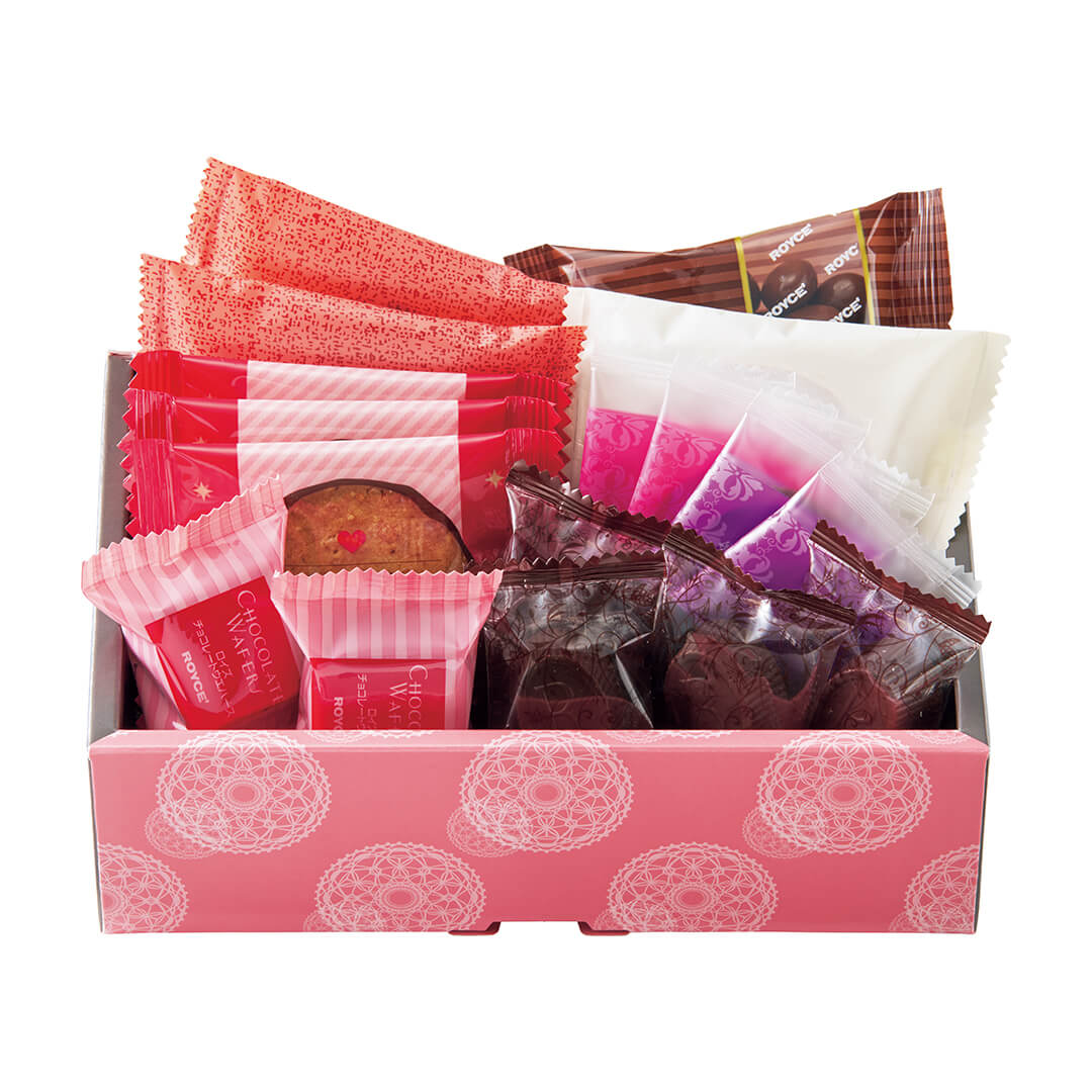 ROYCE' Chocolate - ROYCE' Sweet Assortment (17 Pcs) - Image shows an open box with violet and pink printed borders filled with individually-wrapped chocolates in the colors of orange, red, pink, brown, white, and violet. Text that can be seen include the words Chocolate Wafers and ROYCE'.