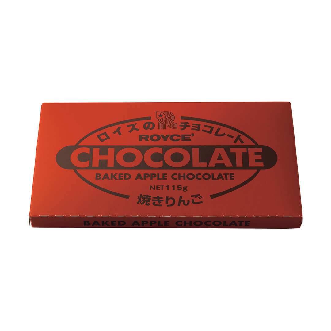 Red rectangular box of ROYCE’ Chocolate Bar Baked Apple, featuring a milk chocolate bar with baked apple filling, available exclusively at select US boutiques.
