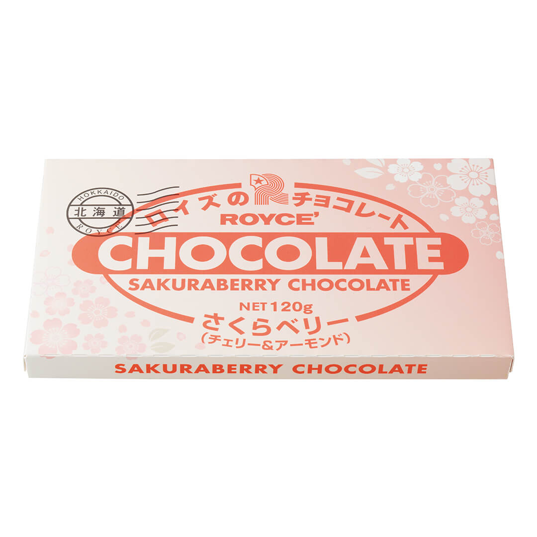 ROYCE' Chocolate - Chocolate Bar "Sakura Berry (Cherry & Almond)" - Image shows a chocolate carton in pink with floral prints. Text in black says Hokkaido ROYCE'. Text in red says ROYCE' Chocolate Sakuraberry Chocolate Net 120g. Text on bottom part says Sakuraberry Chocolate. 