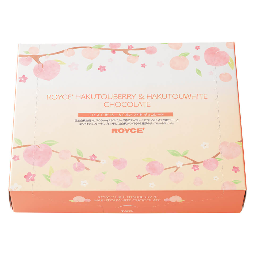 ROYCE' Chocolate - Hakutouberry & Hakutouwhite Chocolate - Image shows a box in the colors of peach and orange, with illustrations of peaches, twigs, and leaves in pink, brown, and green. Orange text in the middle front says ROYCE' Hakutouberry & Hakutouwhite Chocolate ROYCE'. Text in bottom part of the box says ROYCE' Hakutouberry & Hakutouwhite Chocolate.