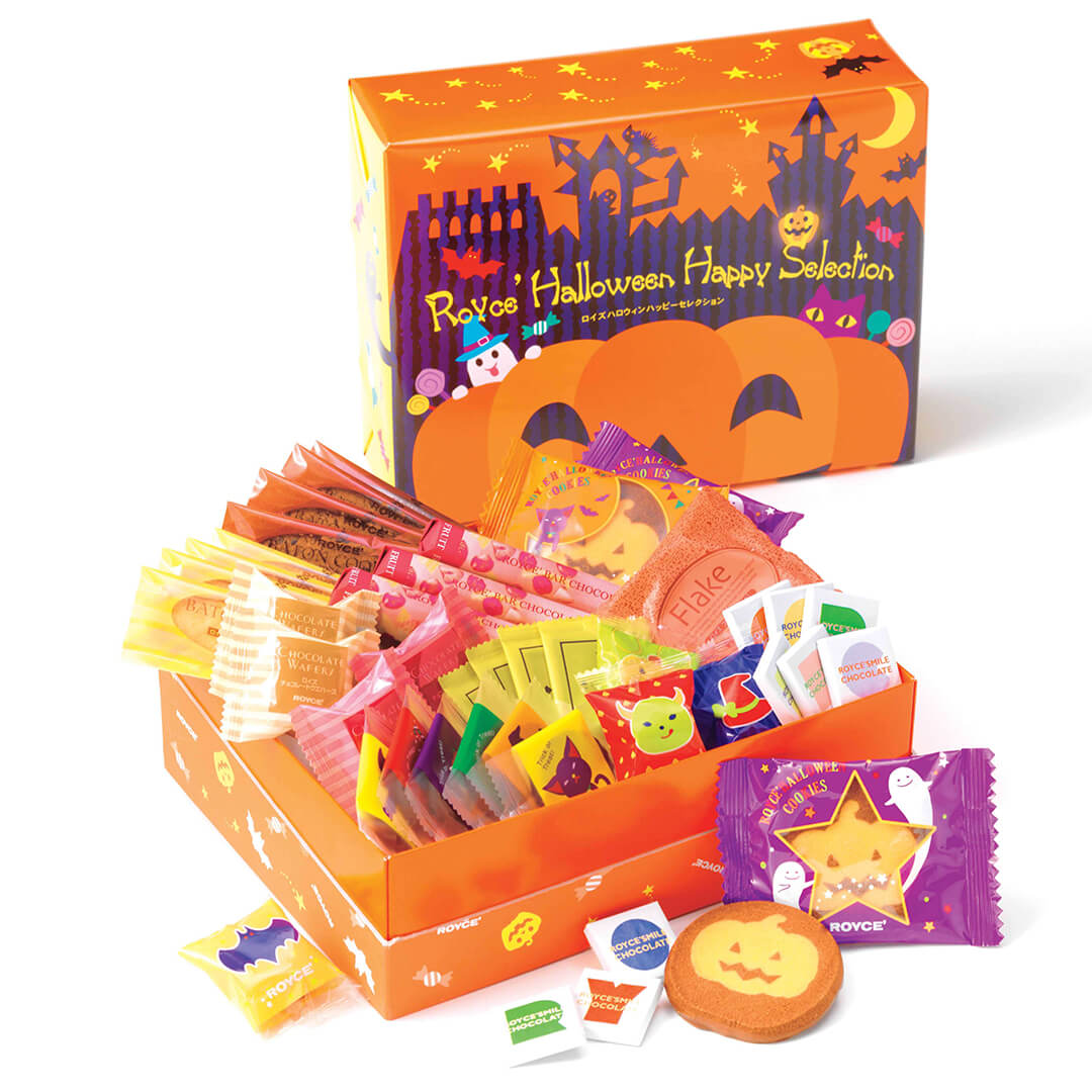 Image shows an orange box on the top right with illustrations of ghosts, animals, stars, and pumpkins. Text says ROYCE' Halloween Happy Selection. Box on lower middle left shows an open orange printed box with individually-wrapped chocolates in various prints and colors. Background is in color white.