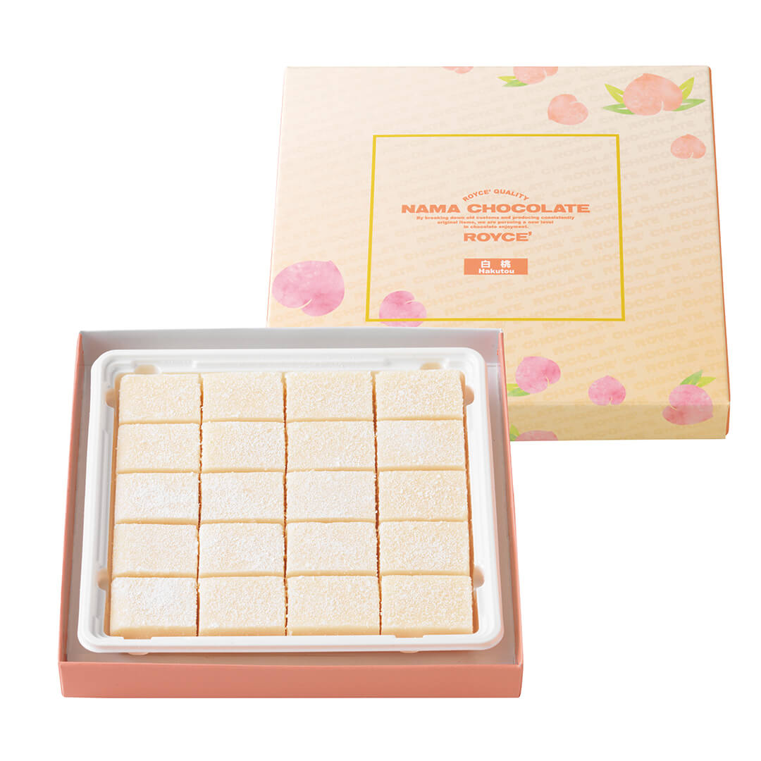 ROYCE' Chocolate - Nama Chocolate "Hakutou" - Image on top shows a peach-colored box with illustrations of peaches. Text inside yellow square says ROYCE' Quality Nama Chocolate By breaking down old customs and producing consistently original items, we are pursuing a new level in chocolate enjoyment. ROYCE' Hakutou. Below shows a peach-colored box with light pink blocks of chocolate inside.