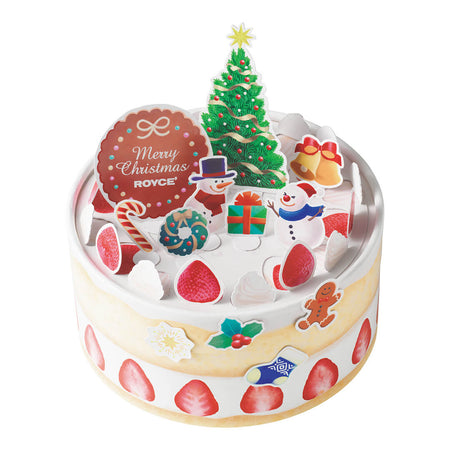 Image shows a yellow round box with white trim and illustrations of red strawberries. On top are red strawberry and white whipped cream cutouts with a green Christmas tree and holiday characters like snowmen, a candy cane, bells, and a gift box. There is also a circle cutout on mid-left in red decorated with dots and a ribbon, with text saying Merry Christmas ROYCE'. Background is in white.