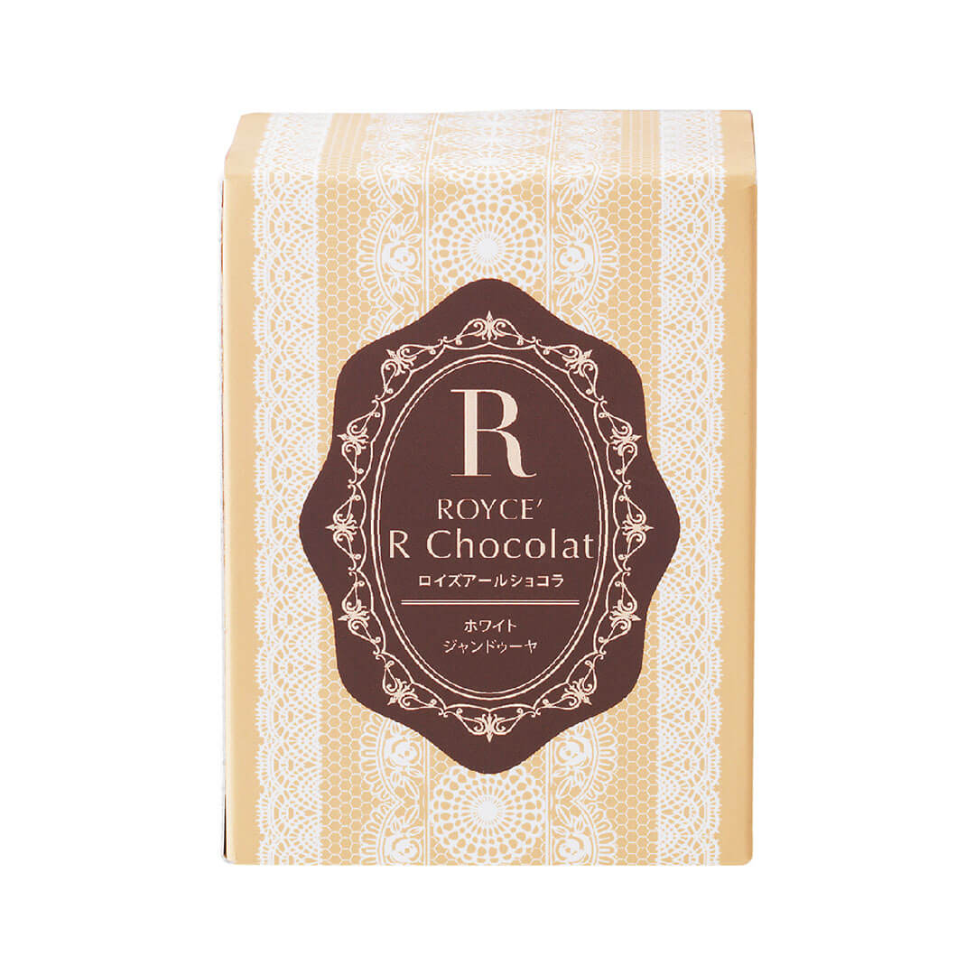 ROYCE' Chocolate - ROYCE' R Chocolat "White Gianduja"  - Image shows a dark yellow box with white lace illustrations and a brown center. Text in the center says R ROYCE' R Chocolat. Background is in white.