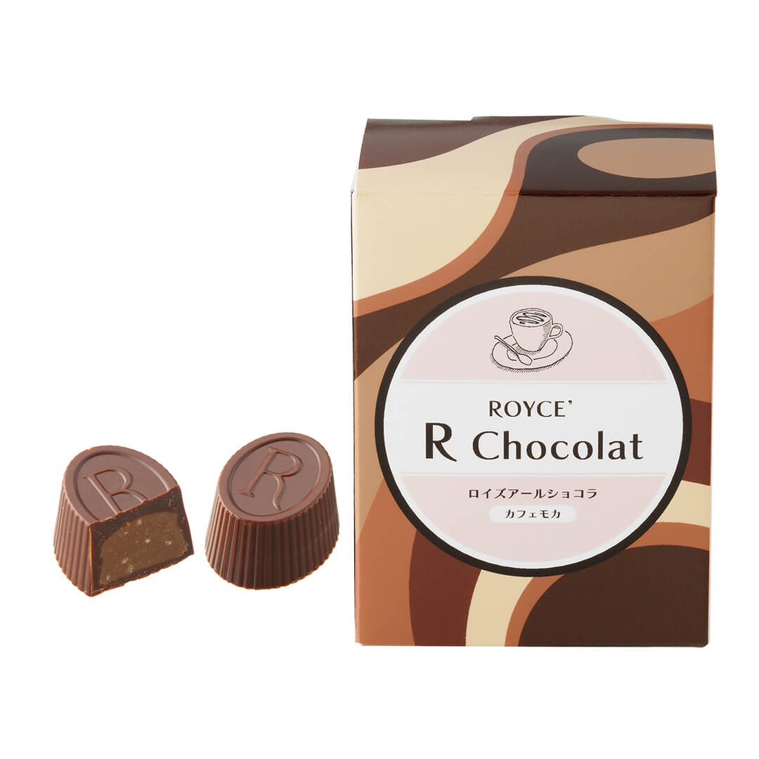 ROYCE' Chocolate - ROYCE' R Chocolat "Caffé Mocha" - Image shows brown oval-shaped chocolates engraved with letter R. Brown box has swirly graphics and an illustration of a cup of coffee. Text says ROYCE' R Chocolat. Background is in white.