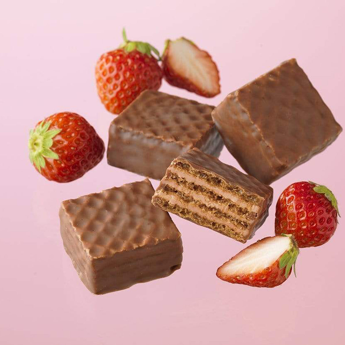 ROYCE' Chocolate - Chocolate Wafers "Strawberry Cream" - Image shows brown chocolate wafers with crisscrossed texture. Accents include red strawberries. Background is in pink color.