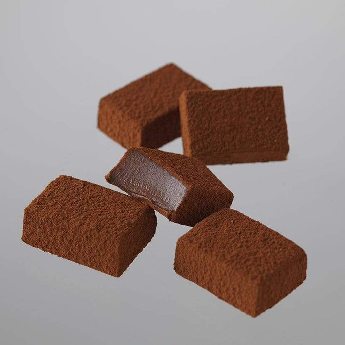 ROYCE' Chocolate - Nama Chocolate "Bitter" - Image shows brown blocks of chocolate with gray background.