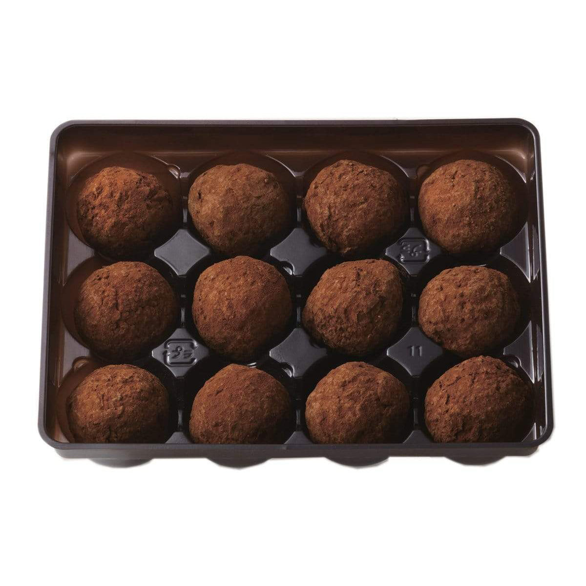ROYCE' Chocolate - Petite Truffe "Orange" - Image shows a brown tray on a white surface filled with brown chocolate balls.