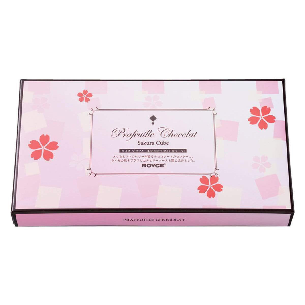 ROYCE' Chocolate - Prafeuille Chocolat "Sakura Cube" - Image shows a pink box with cube and floral prints. Text says Prafeuille Chocolat Sakura Cube ROYCE'. Text below says Prafeuille Chocolat.