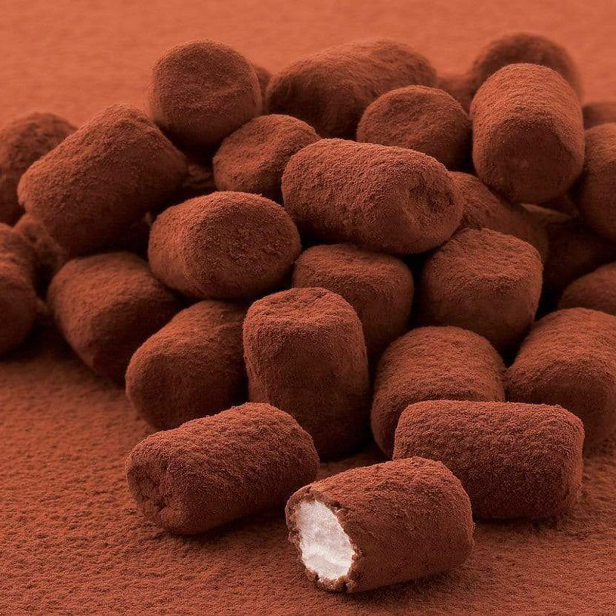 ROYCE' Chocolate - Marshmallow Chocolate "Milk Coffee" - Image shows brown chocolate-coated marshmallows on a brown surface.